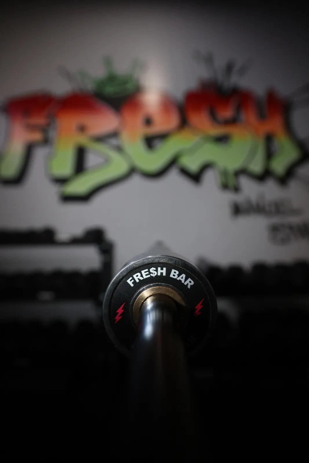 Fresh Bar: The Fresh Bar end cap, red lightning bolts, in front of the FRESH mural at SPS Fit.