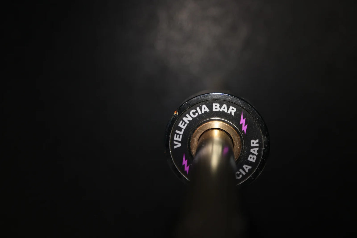 Velencia Bar: The Velencia Bar end cap alone on a dark gym floor.